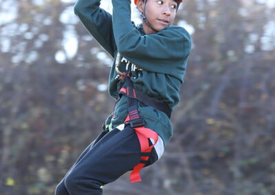 Camper on the zipline at Hispanic Character Camp 2022