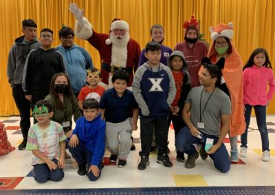 Whiz Kids and Unplugged students with Santa at Whiz Kids Christmas 2021